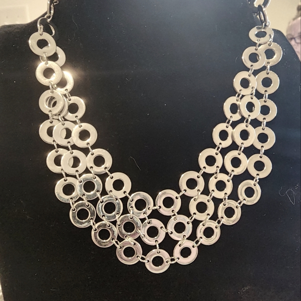Lane Bryant Silvertoned 3 row circle necklace. High polished. Adjustable